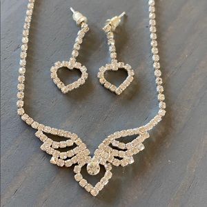 Heart with wings necklace and heart earring set.